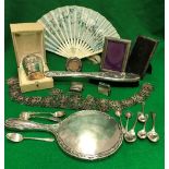 A box of silver and plated items to include a cased christening mug inscribed "Leon",