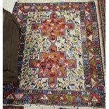 A Kelim rug, the central panel set with two stylised cross medallions on a red and cream ground,