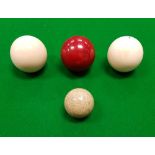 A set of three early 20th Century ivory billiard balls,