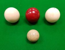 A set of three early 20th Century ivory billiard balls,