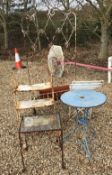 Two metal planters, a circular metal garden table,