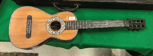 A 19th Century rosewood and mother of pearl inlaid six string guitar by J T L Jerome