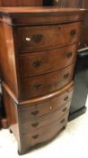 A mid 20th Century burr walnut and cross-banded bow fronted chest of three drawers over a brushing