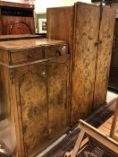 An early to mid 20th Century walnut two door wardrobe and similar bedroom cabinet of two drawer