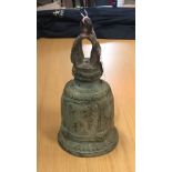 A Chinese Taoist type bronze bell with crown top and big cat mask decoration to body,