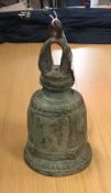 A Chinese Taoist type bronze bell with crown top and big cat mask decoration to body,