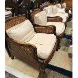 An early to mid 20th Century stained beech framed Bergere five piece suite comprising two seat sofa