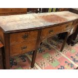 An early George III mahogany shallow bow fronted sideboard of slim proportions the central drawer