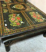 A 20th Century Indian painted teak coffee table with all-over decoration of birds amongst