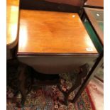 An Edwardian mahogany tea table with fou