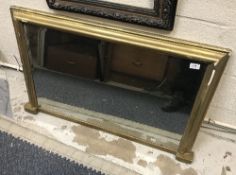 A gilt framed overmantel mirror