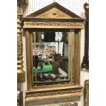 A modern moulded gilt framed wall mirror