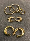 Four pairs of 9 carat gold hoop earrings