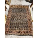 A Kashan rug, the central panel set with