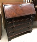 A 19th Century mahogany bureau, the fall