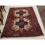 A Caucasian rug, the central panel set w