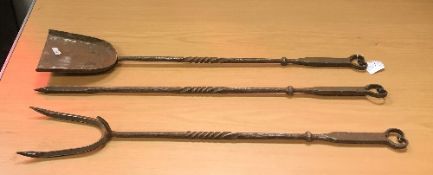 A set of three steel fire tools in the A