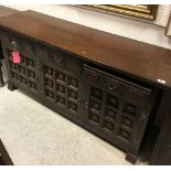 A modern oak sideboard dresser with plain top over three drawers and three panelled cupboard doors