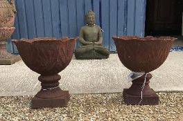 A pair of modern cast iron garden urns o