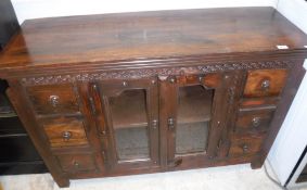 A modern teak sideboard with two glazed