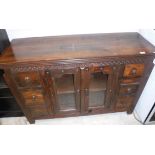 A modern teak sideboard with two glazed