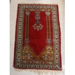 A Bokhara rug the central panel set with