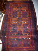 A Belouch rug the central panel set with