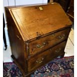 An 18th Century elm bureau the sloping f