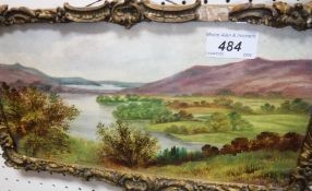 A framed painted ceramic tile of a lands