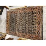 A Kashan rug, the central panel set with