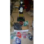 A box containing seven modern coloured metal bottle openers including Guiness, Landrover,