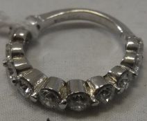 An 18 carat white gold eleven stone set diamond ring, approx 2.2 carats, size N, approx 4.