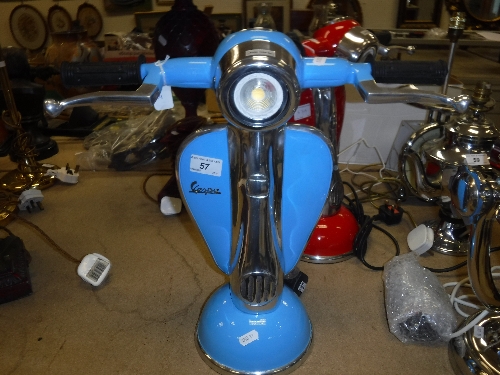 A pale blue painted and polished metal "Vespa" table lamp
