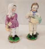 A pair of Derby type figures of fish sellers, she No'd to base 62, he indistinctly 61?,