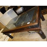 A modern Indian hard wood and iron glass top coffee table on turned legs Size approx.