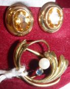 A pair of 9 carat gold mounted citrine set clip on earrings, of oval form,