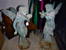 Two cast iron fairies and two cast iron horses heads
