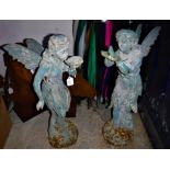 Two cast iron fairies and two cast iron horses heads