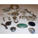 A collection of silver jewellery to include a silver bangle, silver ingot pendant,