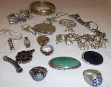 A collection of silver jewellery to include a silver bangle, silver ingot pendant,