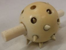 A 19th Century carved ivory spiked erotic pleasure ball, approx 6.