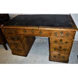 A Victorian oak double pedestal desk with three frieze drawers,