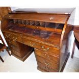 A mahogany tambour top desk in the George III taste,