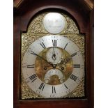 An 18th Century long case clock the eight day movement with brass arch dial and silver chapter ring