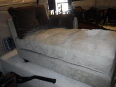 A modern upholstered chaise longue on square tapered legs,