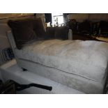 A modern upholstered chaise longue on square tapered legs,