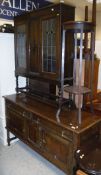 A leaded glazed two door cabinet, oak sideboard, oak plant stand,