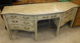 A green/cream painted serpentine fronted sideboard in the Louis XV taste,