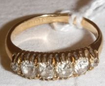 An 18 carat gold five stone diamond set ring, size P, total weight 3.7 g, approx 0.