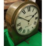 A brass cased dome top wall mounted clock, the movement by Thomas Armstrong & Bro.